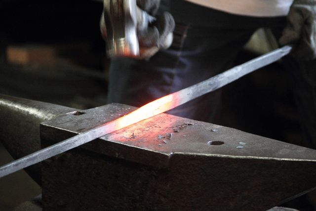 Making a sword in a modern forge.