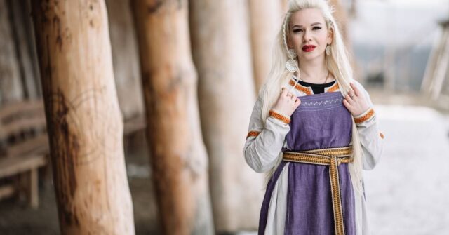 A female viking viking wearing a traditional apron dress.