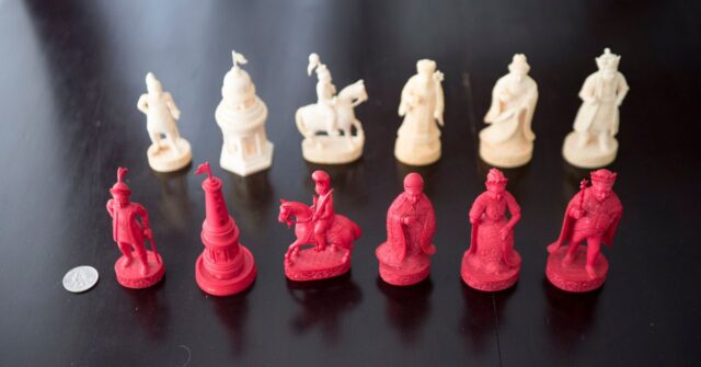Various carved ivory chess pieces.