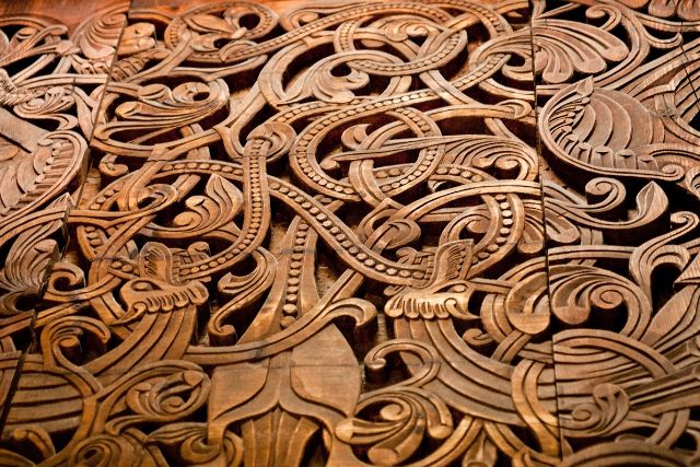 An intricate carving of norse symbols.