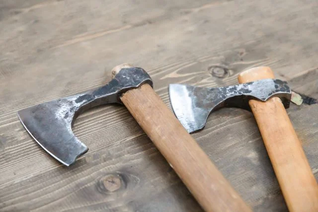 A close up of a pair of battle axes.
