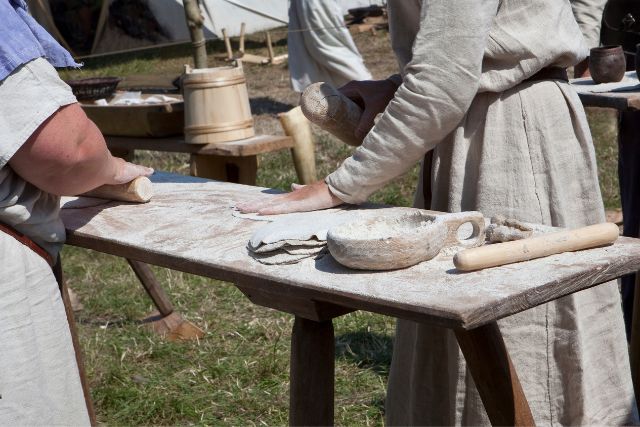 Traditional bread making in a viking market.