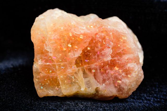 An uncut sunstone crystal with copper illusion.