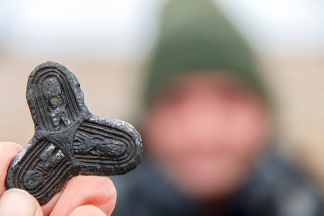Close up photo of a bronze viking age broovh.