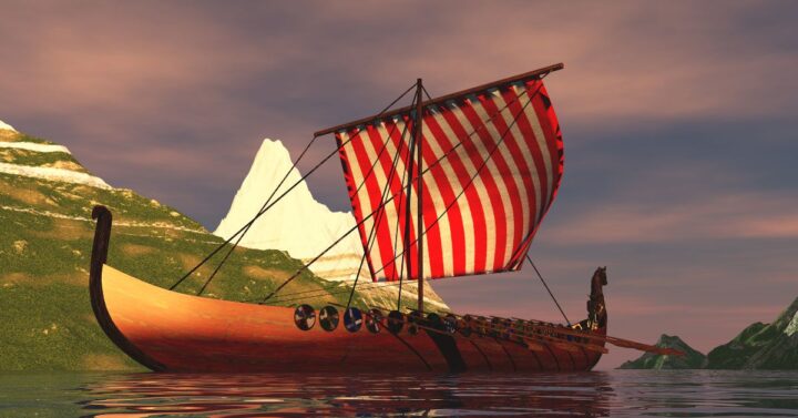 Viking ship sailing between snow-capped mountains.