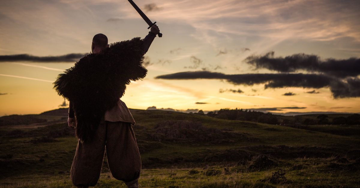 Viking warrior raising his sword.