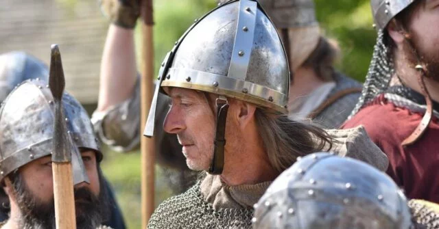 Several men in viking costumes on a festival celebration.