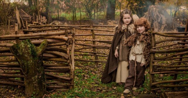 Viking children in a village settlement.