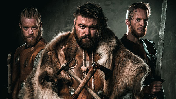 Viking warriors holding axes and swords ready for battle
